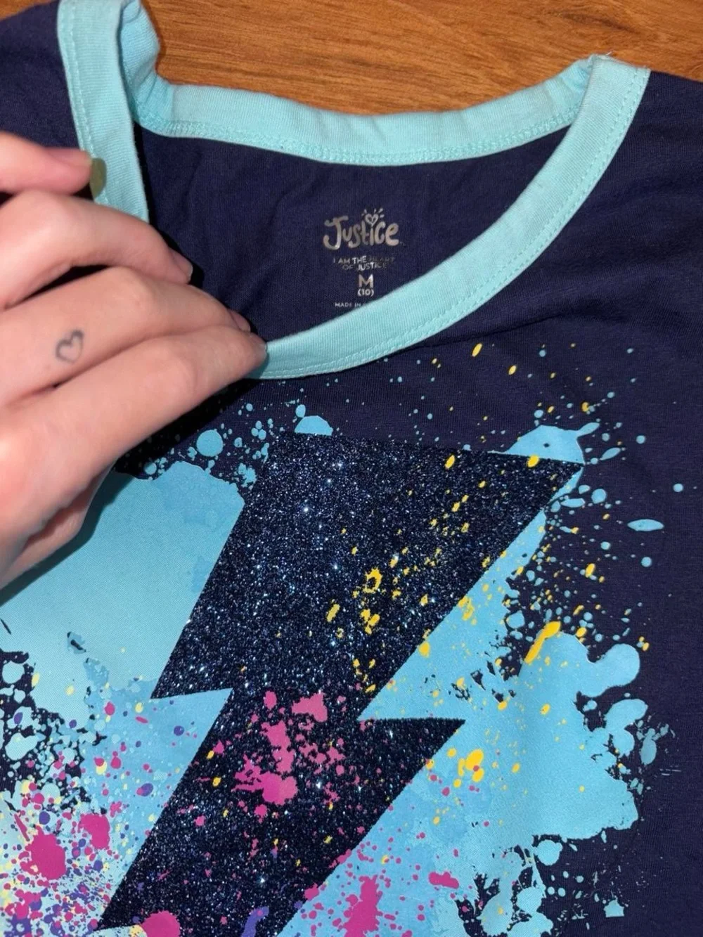Y2K Justice navy blue tee with white lightning bolt graphic